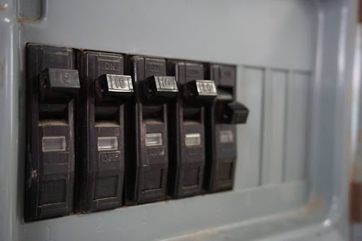 Circuit breakers on an electrical panel.